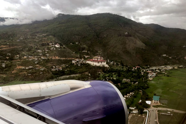 View of Paro Rinpung Dzong and the valley during takeoff