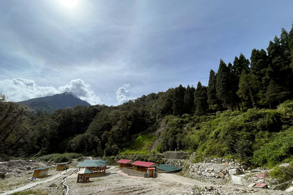 Scenic view of Gasa Hot Spring, surrounded by lush nature and serene waters.