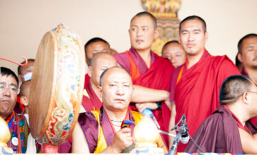 Monks and laymen performs duirng Thimphu Tshechu Festival Tour