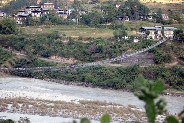 Things to do in Bhutan with Kids. Longest suspension bridge connects horizons, showcasing breathtaking engineering mastery.