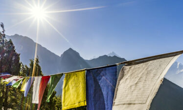 During your 5-day Bhutan tour, you can experience the serene beauty of fluttering prayer flags, which bring both peace of mind and beautiful scenic views.