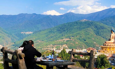 Couple enjoying the view of Buddha Point from Kuensel Phodrang Park