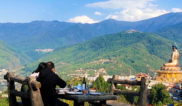 Couple enjoying the view of Buddha Point from Kuensel Phodrang Park