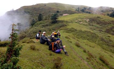 Sagala Trek in Bhutan. Guest taking rest and enjoying tea during the trek