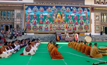 A large portrait of Buddha on display