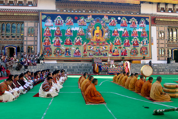 A large portrait of Buddha on display