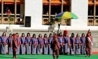 Dzongkhag dancers performing traditional dance during the Tshechu