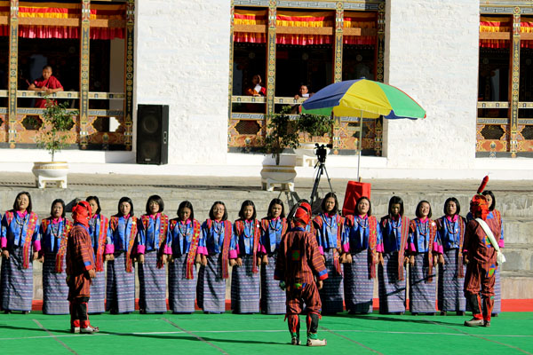 Dzongkhag dancers performing traditional dance during the Tshechu